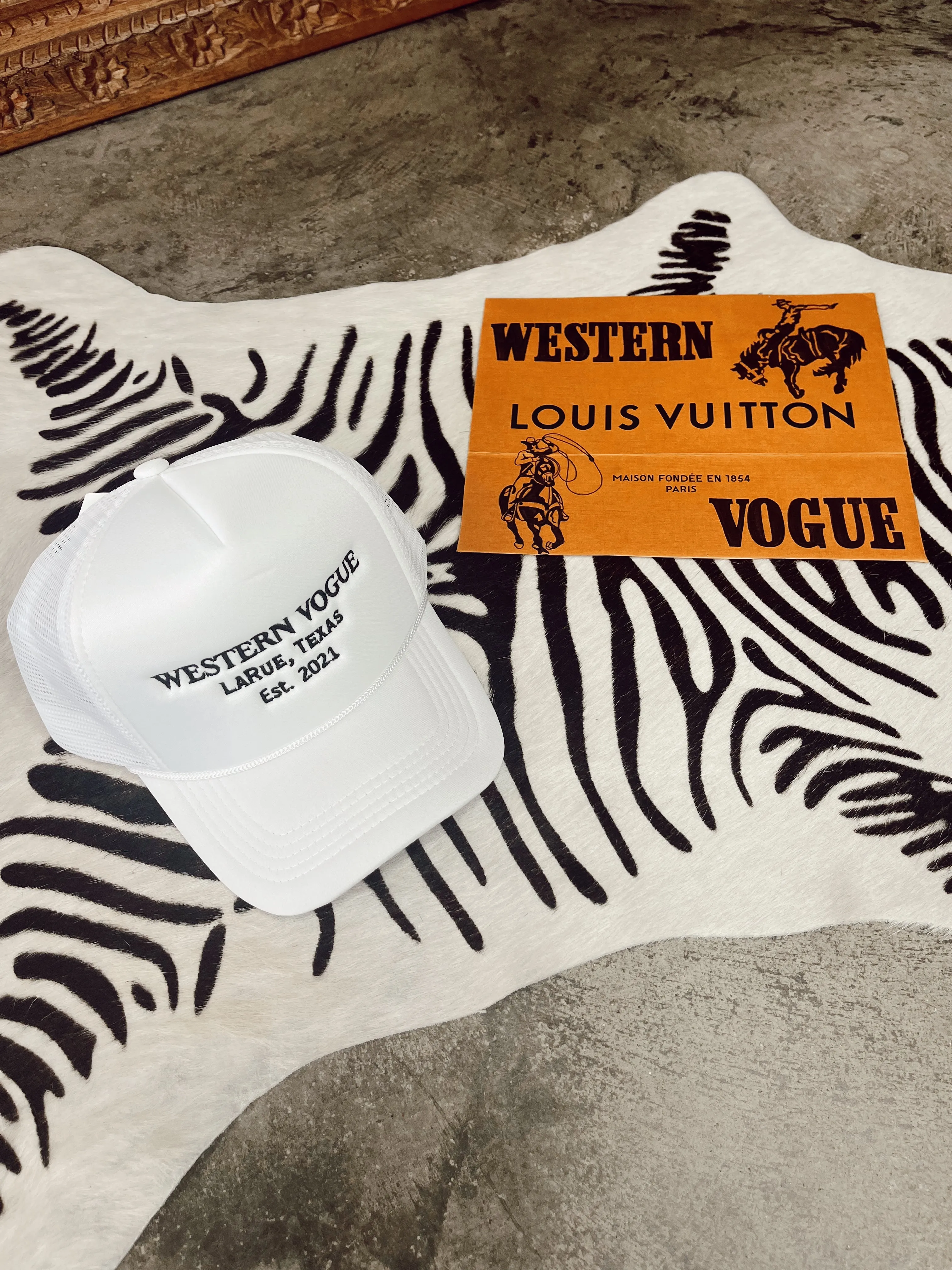 The EST. 2021 Western Vogue Trucker Hat in White